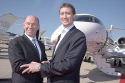 Jordan Hansell, Chairman and CEO, NetJets (right) and Alain Bellemare, President and CEO, Bombardier Inc. (left) at EBACE 2015.