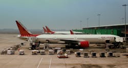 Air India A320 and Boeing 777 300ER S at Indira Gandhi Airport Delhi India February 2013 559150b892bef