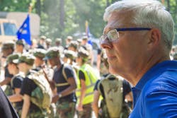 Daniel R. Sitterly, principal deputy assistant secretary of the Air Force for Manpower and Reserve Affairs, takes in the activity at the Virginia Wing Encampment at Fort Pickett.