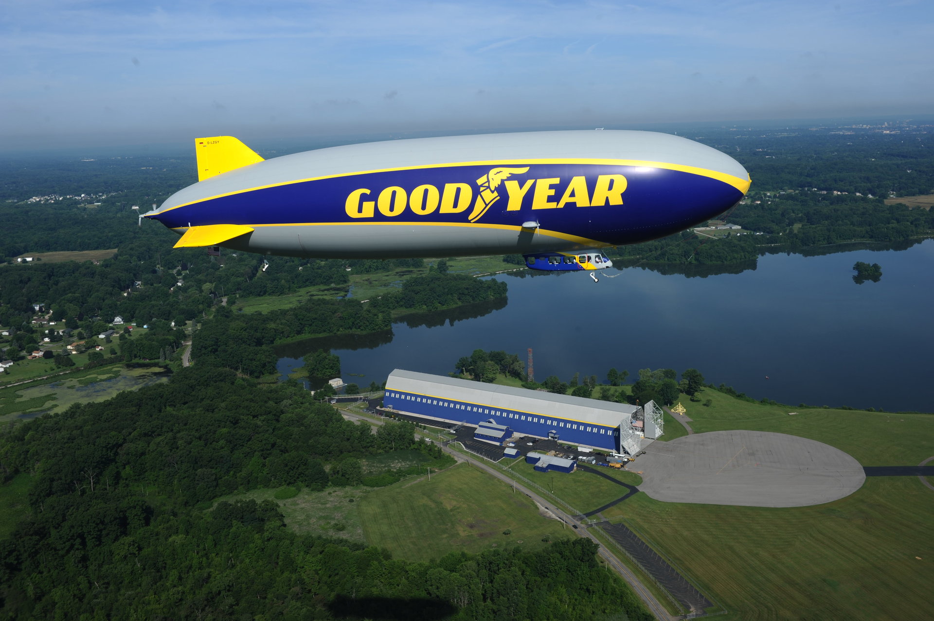 Goodyear's new 'Wingfoot One' airship flying over its home hanger at Wingfoot Lake, Ohio.