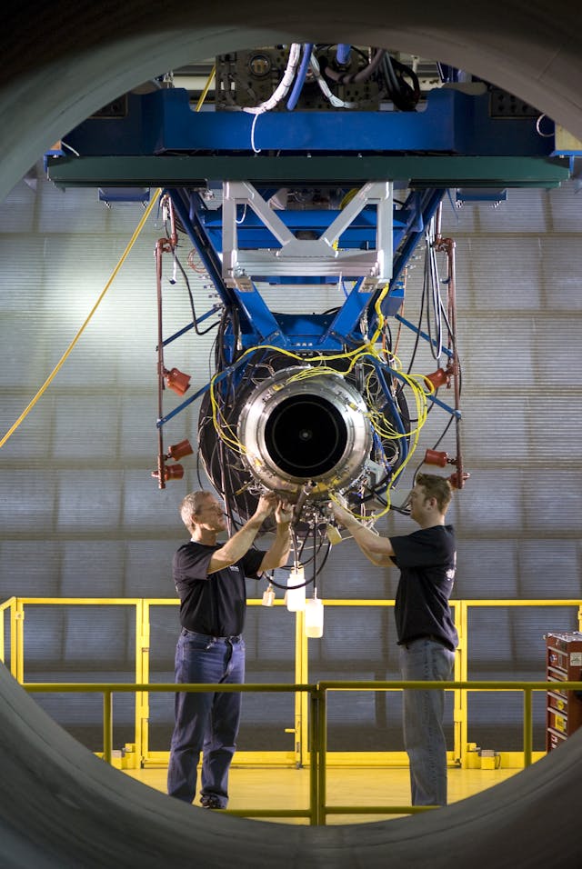 Vector Aerospace technicians work on a JT15D turbofan engine.