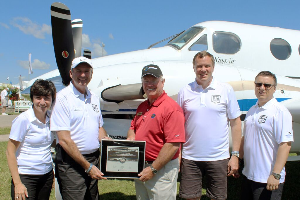 Pictured, from left, are: P&WC executives Maria Della Posta, Senior Vice President; Denis Parisien, Vice President, General Aviation Programs; John Saabas, President, and Nick Kanellias, General Manager, Sales & Marketing, congratulate Blackhawk President and CEO Jim Allmon on 16 years of success.