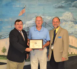 Michael J. Mullaney, FAA Southern Region (left) and Neil Baker, Maintenance Inspector, South Carolina FSDO (right) present Gary Ward with the Charles Taylor Master Mechanic Award. Michael J. Mullaney, FAA Southern Region (left) and Neil Baker, Maintenance Inspector, South Carolina FSDO (right) present Gary Ward with the Charles Taylor Master Mechanic Award.