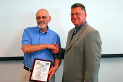Justin receiving the award from Mark Harden Justin receiving the award from Mark Harden