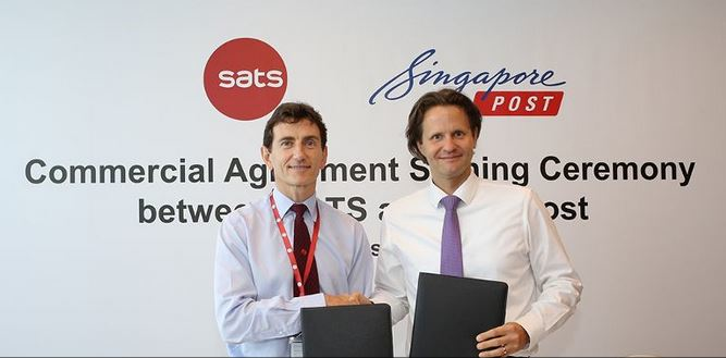 Alex Hungate, president and CEO of SATS and Dr. Wolfgang Baier, group CEO of SingPost, solidify the partnership between SATS and SingPost for future airmail handling.