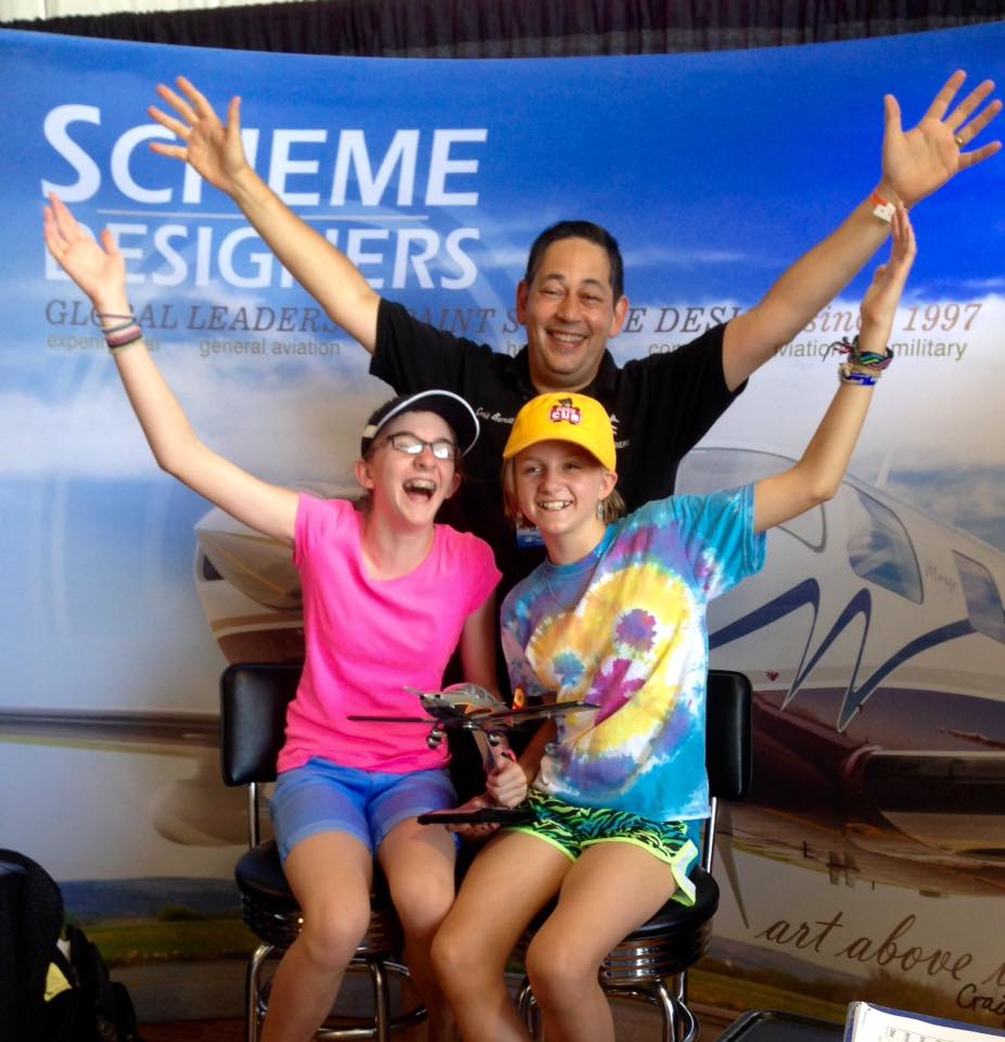 Veteran Scavenger Hunt sister team, Amelia (12) and Piper (10) Stagg (pictured with Craig Barnett, Scheme Designers President & Founder) took home this year&rsquo;s grand prize for the second year in a row. The whole Stagg family got into the spirit of the paint scheme hunt, making it an important part of their visit to AirVenture.