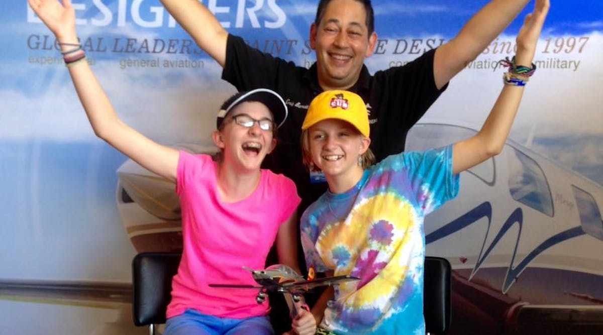 Veteran Scavenger Hunt sister team, Amelia (12) and Piper (10) Stagg (pictured with Craig Barnett, Scheme Designers President &amp; Founder) took home this year&rsquo;s grand prize for the second year in a row. The whole Stagg family got into the spirit of the paint scheme hunt, making it an important part of their visit to AirVenture.