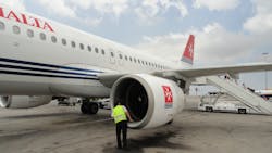 A crewman performs a pre-flight inspection on an Airbus A320. A crewman performs a pre-flight inspection on an Airbus A320.