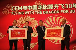 The leaders of China Eastern Yunnan and Air China Southwest were presented with a special gift during the CFM 30th anniversary celebration in Beijing, China. From left: Chaker Chahrour, vice president of Global Sales and Marketing for CFM parent company GE Aviation; Li Jingfeng, deputy general manager of China Eastern Yunnan; Chai Weixi, vice president of Air China; and Jean-Paul Ebanga, president and CEO of CFM International The leaders of China Eastern Yunnan and Air China Southwest were presented with a special gift during the CFM 30th anniversary celebration in Beijing, China. From left: Chaker Chahrour, vice president of Global Sales and Marketing for CFM parent company GE Aviation; Li Jingfeng, deputy general manager of China Eastern Yunnan; Chai Weixi, vice president of Air China; and Jean-Paul Ebanga, president and CEO of CFM International