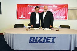 From left: Zhao Wei, President of Jing Cheng Group, and Brian Barber, BizJet Vice President of Sales and Marketing. From left: Zhao Wei, President of Jing Cheng Group, and Brian Barber, BizJet Vice President of Sales and Marketing.