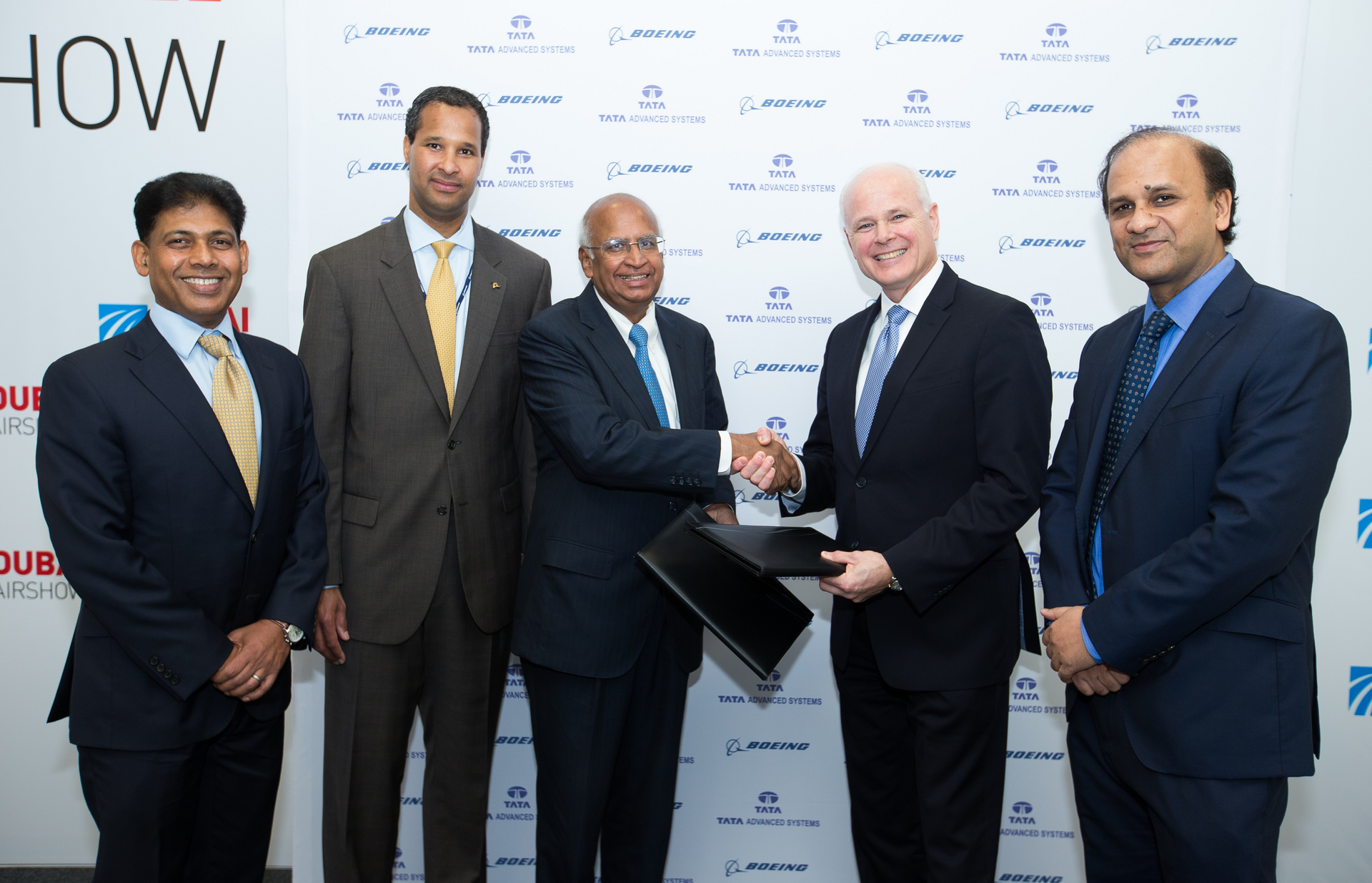 Tata Advanced Systems Chairman S. Ramadorai (third from left) and Tom Bell, senior vice president, Global Sales & Marketing, Boeing Defense, Space & Security (second from right) sign the agreement to create a joint venture. Boeing International President Marc Allen (second from left), Boeing India President Pratyush Kumar (left) and Tata Advanced Systems CEO Sukaran Singh (right) attended the signing ceremony.
