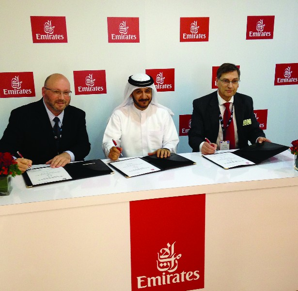 Representatives from Emirates and Pall Aerospace sign the agreement November 10 at the Dubai Air Show.