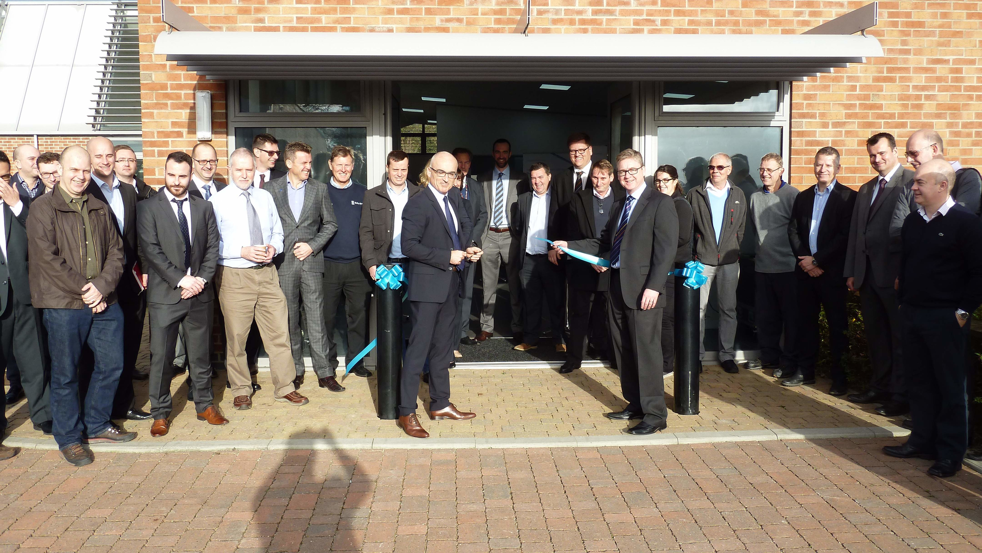 Ribbon-cutting ceremony by Christian Le Du, GE&rsquo;s European Inspection Technologies Sales Leader (left) and Neil Bloomfield, GE&rsquo;s Inspection Technologies Global Radiography Sales Leader.