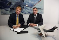 Jackson Schneider, president and CEO, Embraer Defense &amp; Security, and Ulrich Sasse, president of Rheinmetall Simulation and Training, sign the contract at FIDAE.