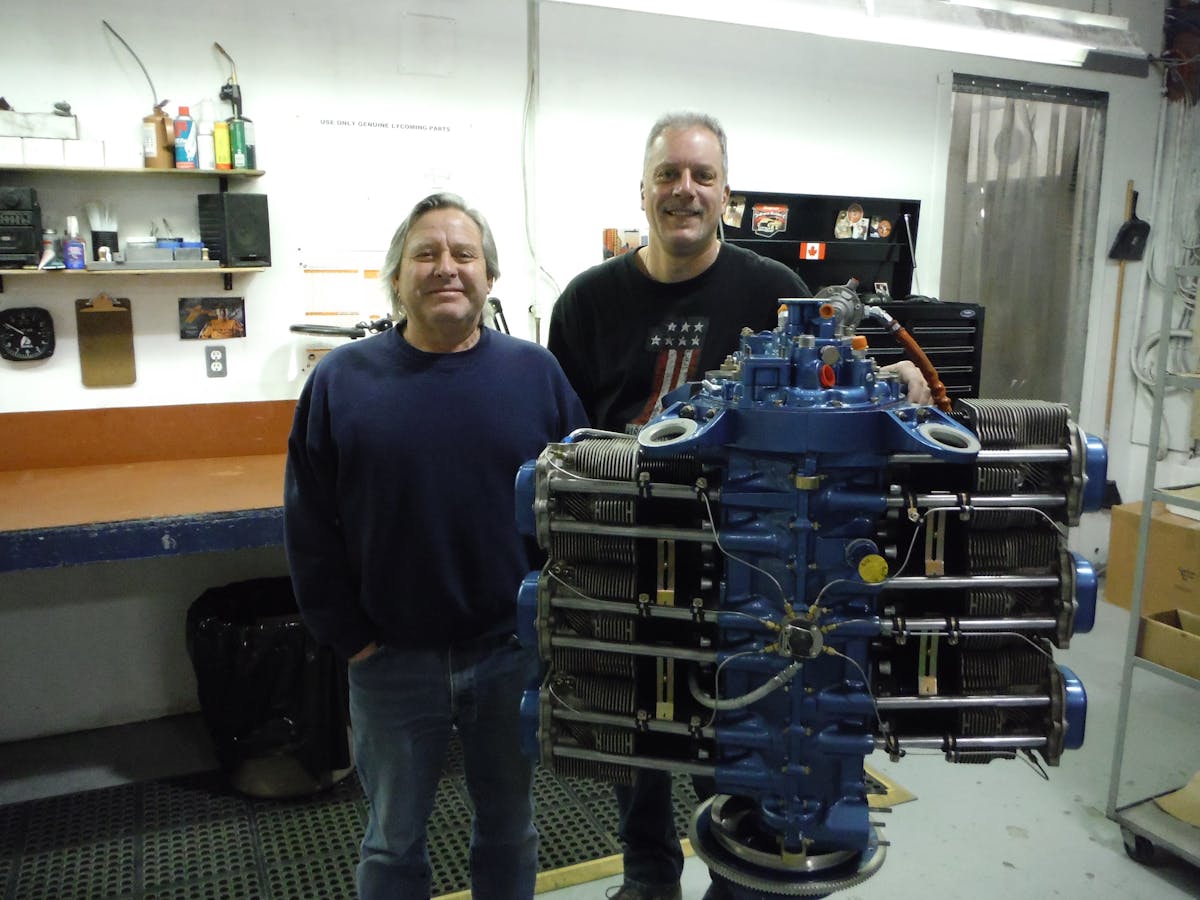 Dwain Harris (L) Harmon Rocket builder and Rob Horvath, Master Engine Builder with the 2,100th engine assembled by Aero Sport Power.
