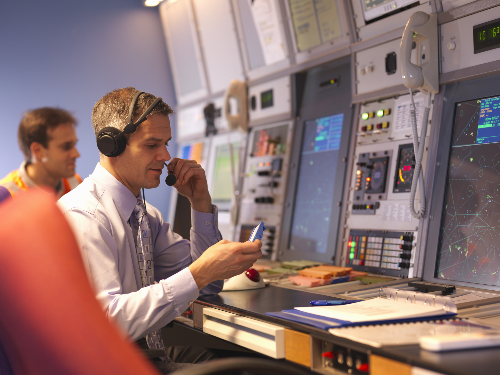 Air Traffic Controllers in radar room.