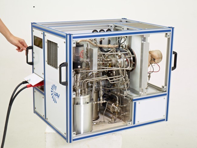 UAV Turbines Inc's Engine-In-A-Box test and demonstration platform. The EIB includes an operating 10-hp engine, filters, a 3-kW generator, control system, display, and gas tank in an enclosed unit, roughly the size of a mini-refrigerator.