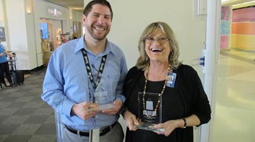 Tom DiStefano, manager of Cibo Bistro &amp; Wine Bar, and Daniela Biscaro, manager of Fire &amp; Ice, posing with their trophies