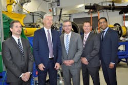From left to right, inside the new test cell, are: Steve Tully, Director Supply Management, Contracts &amp; Real Estate &ndash; Jazz Aviation LP; Declan O&rsquo;Shea, President and CEO of Vector Aerospace; The Honourable J. Heath MacDonald, Minister of Economic Development and Tourism - PEI Government; Jeff Poirier, President of Vector&rsquo;s Engine Services &ndash; Atlantic division; and Satheeshkumar Kumarasingam, Senior VP Commercial Services - Pratt &amp; Whitney Canada.