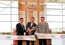 Cutting the ribbon, from left to right, Charles A Gratton, vice president, real estate and commercial services, A&eacute;roports de Montr&eacute;al; Montreal Canadiens President and CEO Geoff Molson; HMSHost Vice President of Business Development Stephen Douglas.