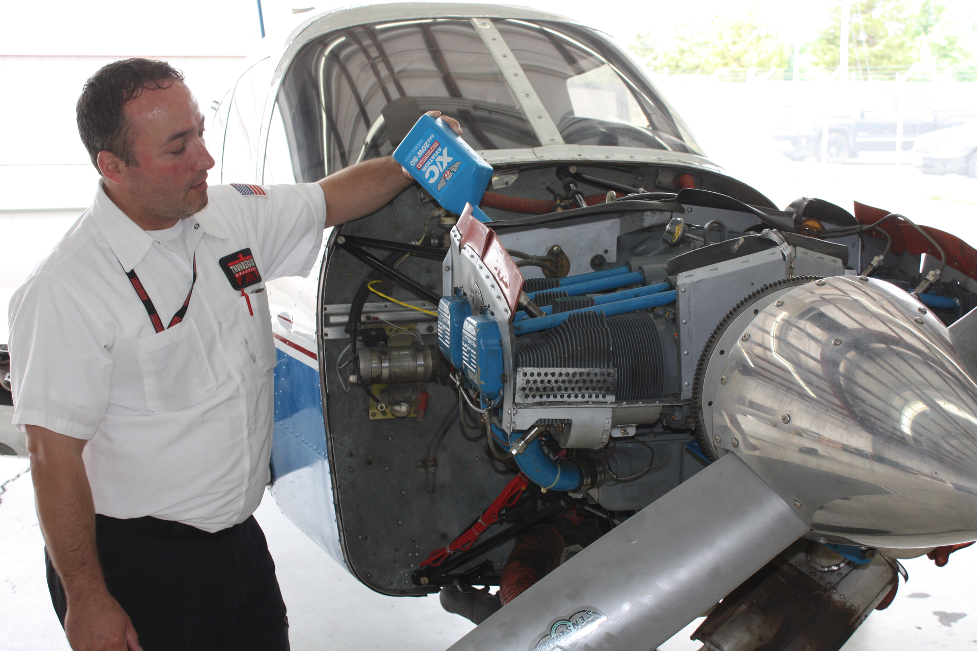 Shane Falz with Thunderbird Aviation in Minneapolis servicing a Piper PA-28.