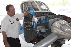 Shane Falz with Thunderbird Aviation in Minneapolis servicing a Piper PA-28. Shane Falz with Thunderbird Aviation in Minneapolis servicing a Piper PA-28.