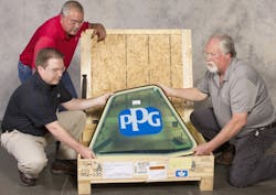 EN ROUTE TO FRANCE &ndash; A PPG enhanced-design sliding cockpit window is packed at PPG&rsquo;s Huntsville, Alabama, plant for shipment to Airbus in Saint-Nazaire, France, to be installed in an A320neo airplane front section that will be sent for final assembly and customer delivery. Pictured, from left, are Stirling Macfarlane, PPG segment manager, commercial original equipment manufacturer (OEM) transparencies; and PPG shipping clerks David Knoer and Tim Clutts.