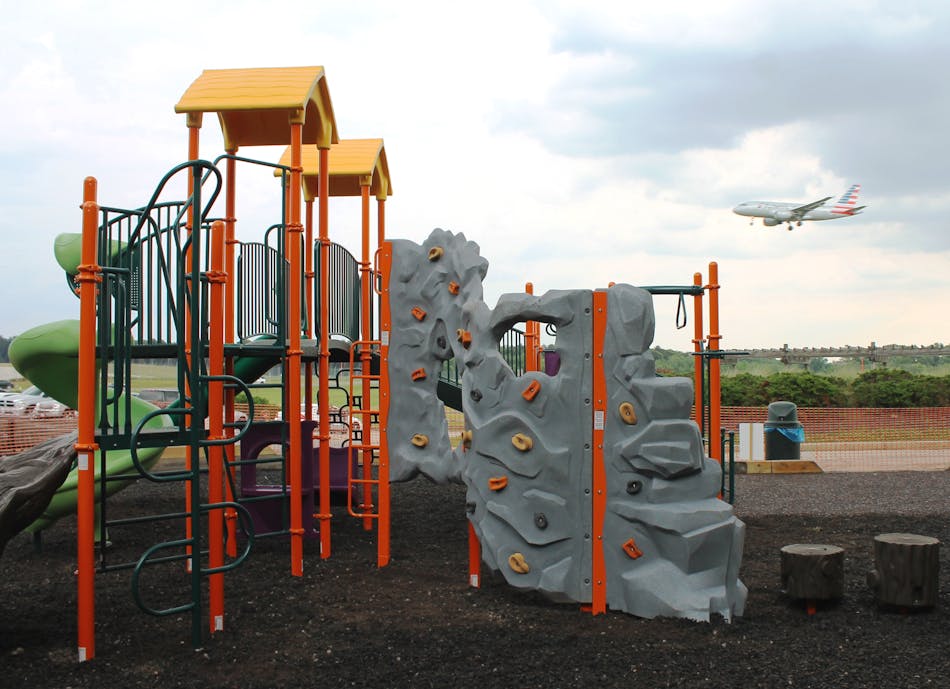 The playground replaces equipment removed in December.