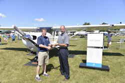 Doug May, vice president of Piston Aircraft presents Skyhawk keys to Stephen Pfanner, Kent State University chief flight instructor at Textron Aviation's static display at the Experimental Aircraft Association (EAA) AirVenture. Doug May, vice president of Piston Aircraft presents Skyhawk keys to Stephen Pfanner, Kent State University chief flight instructor at Textron Aviation's static display at the Experimental Aircraft Association (EAA) AirVenture.