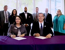 Representatives from Kansas State University&apos;s Polytechnic Campus and Kansas Wesleyan University sign an agreement July 11 to enable unmanned aircraft systems students at Kansas State Polytechnic and emergency management students at Kansas Wesleyan to cross-register and earn a minor in the other institution&apos;s program. Front row, from left: Verna Fitzsimmons, dean and CEO of Kansas State Polytechnic, and Matt Thompson, president of Kansas Wesleyan University. Back row, from left: Bernie Botson, deputy director of emergency management for Saline County; Kendy Edmonds, junior in Kansas State Polytechnic&apos;s UAS program; Lonnie Booker Jr., director of Kansas Wesleyan University&apos;s emergency management program; Kurt Carraway, executive director of Kansas State Polytechnic&apos;s UAS program; Bill Backlin, Kansas Wesleyan University&apos;s interim provost; and Alysia Starkey, associate dean of undergraduate studies at Kansas State Polytechnic.
