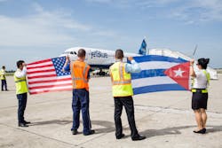 Crewmembers at the Santa Clara Abel Santamar&iacute;a International Airport in Cuba welcome JetBlue flight 387, the first commercial flight to Cuba from U.S. in more than 50 years.