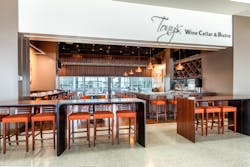 Tony’s Wine Cellar & Bistro welcomes passengers from across the concourse with its impressive wine display and swank, focal point bar. Tony’s Wine Cellar & Bistro welcomes passengers from across the concourse with its impressive wine display and swank, focal point bar.