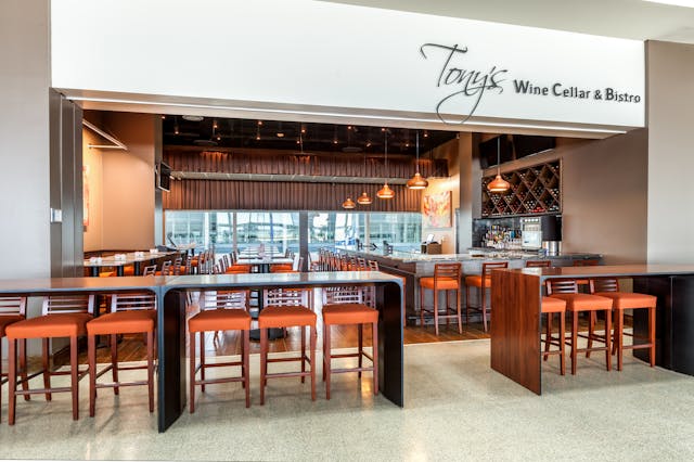 Tony&rsquo;s Wine Cellar &amp; Bistro welcomes passengers from across the concourse with its impressive wine display and swank, focal point bar.
