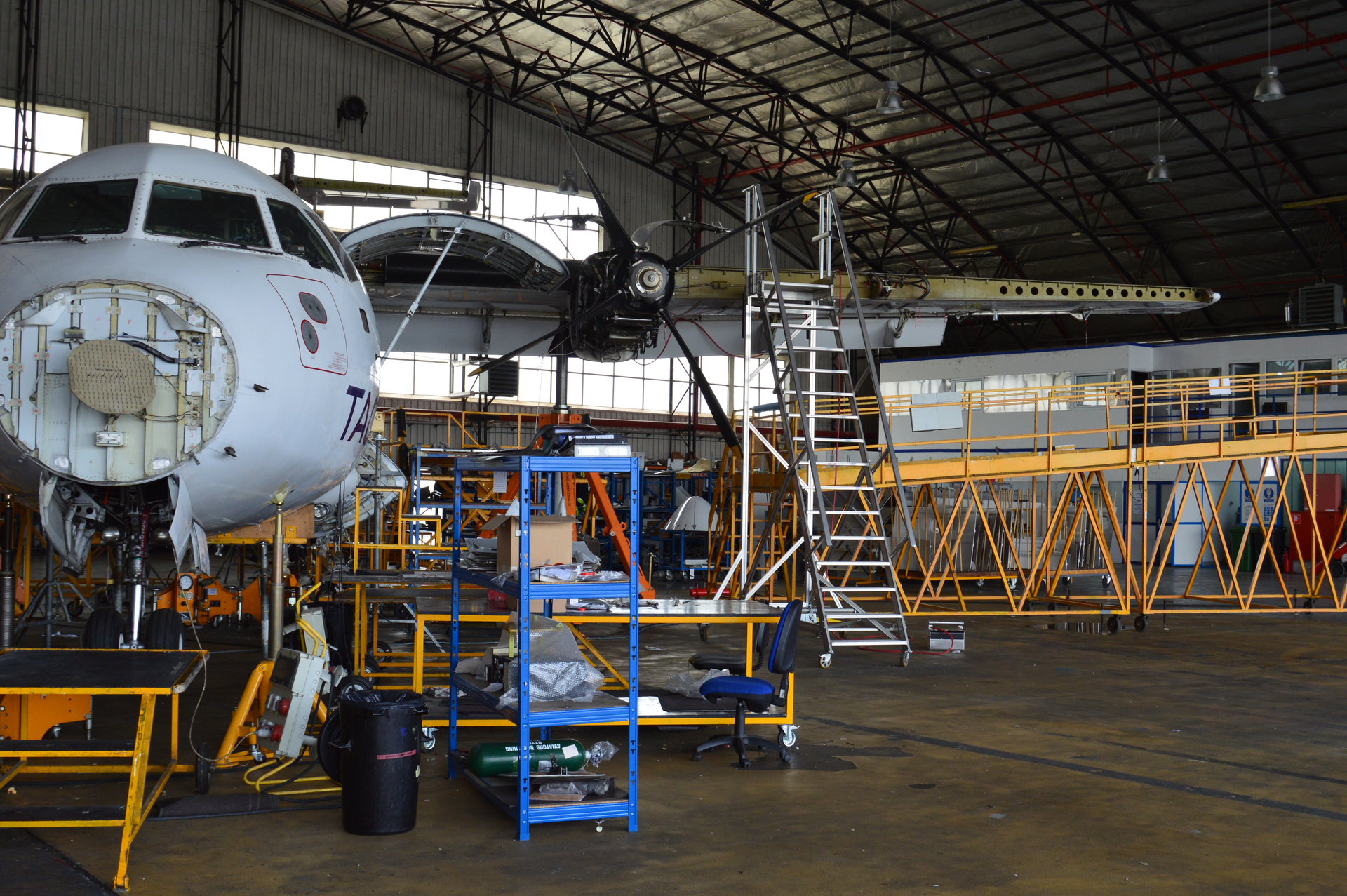 An ATR undergoes heavy maintenance in one of the three maintenance hangars available.