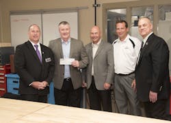 The recent $10,000 donation supports the electronics fabrication capabilities in the Innovation Labs located at the WIU-QC campus. In the photo, L to R: Paul Plagenz, Western Illinois University-Quad Cities development director; Greg Sahr, president, Elliott Aviation; Jeff Hyland, chief administrative and financial officer, Elliott Aviation; Mark Wilken, VP of avionics program and operational logistics, Elliott Aviation; and William Pratt, director, WIU School of Engineering.