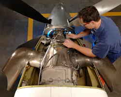 Technician working on a PT6. Technician working on a PT6.