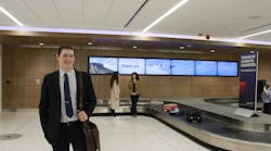 New digital signage inside the La Crosse Airport terminal guides passengers the baggage claim.