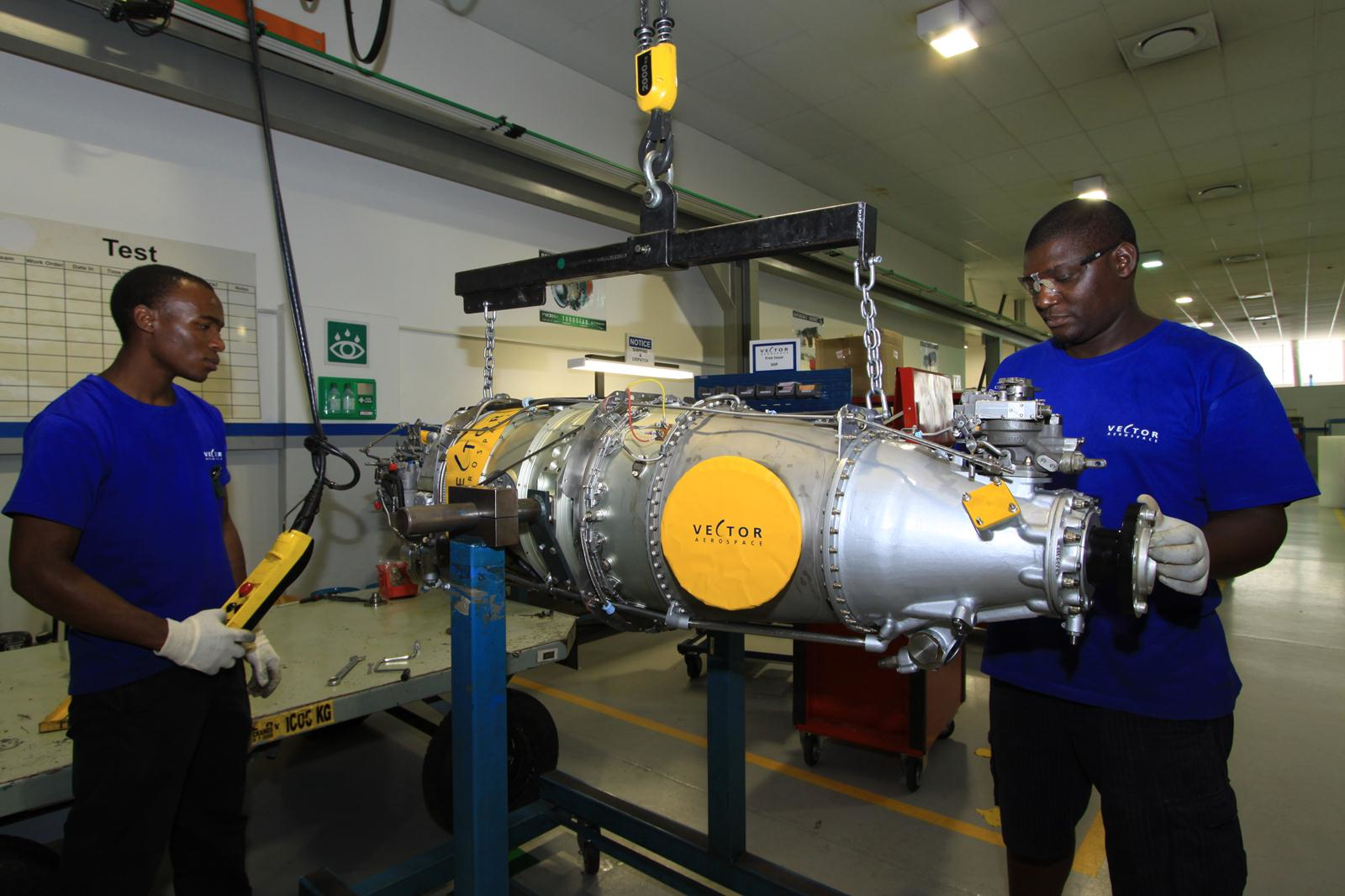 Vector technicians work on aircraft engine at Johannesburg facility.