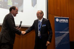 Jean-Philippe Bedos, AH VP Supply Chain Quality Management - Strategic Procurement, in the left, with Olivier Riberon, Elbit Systems representative, in the right, during the ceremony.