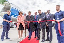 Tatyana Arslanova, Vice President, Strategic Management and Charter Cargo Operations at Volga-Dnepr Group, cuts the red ribbon to mark the handover of the new 747-8F to AirBridgeCargo, joined by Sergey Lazarev, General Director of AirBridgeCargo Airlines, and Alexey Isaykin, President of Volga-Dnepr Group.