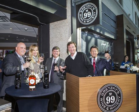 Toasting the opening of No. 99 Gretzky&rsquo;s Wine & Whisky from left to right, Neil Thompson, vice president of operations at HMSHost; Janet Gretzky; Tom Ruth, president and CEO of Edmonton International Airport; Wayne Gretzky; and Jeff Yablun, chief operating officer at HMSHost.