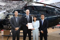 Diana Chou, chairwoman of Aerochine companies, receives the certificate of Authorized Customer Service Facility from Bell Helicopter. Diana Chou, chairwoman of Aerochine companies, receives the certificate of Authorized Customer Service Facility from Bell Helicopter.