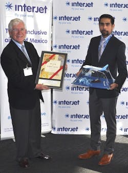 Interjet CEO Juan Luis Garza and CDA Deputy Commissioner Alex Leon exchange gifts at the airline's launch at O'Hare. Interjet CEO Juan Luis Garza and CDA Deputy Commissioner Alex Leon exchange gifts at the airline's launch at O'Hare.