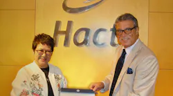 Hactl Finance Director Amy Lam receives the IGOM certificate from IATA Head of Ground Operations Joseph Suidan.
