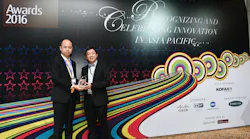 Hactl’s senior manager – performance enhancement, Eric Poon (left), receives the award trophy from Questex Asia general manager Jimmy Yu.