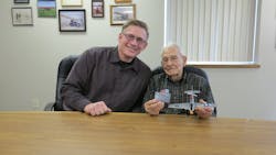 Red Oak Airport Manager Kevin McGrew, left, with Ernie Smith, the world&apos;s oldest active pilot.