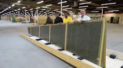 NIAR research engineers Supun Kariyawasam, Upul Palliyaguru and Waruna Seneviratne and Airbus employee James Werbin display an Airbus A300 part donated for NIAR research.