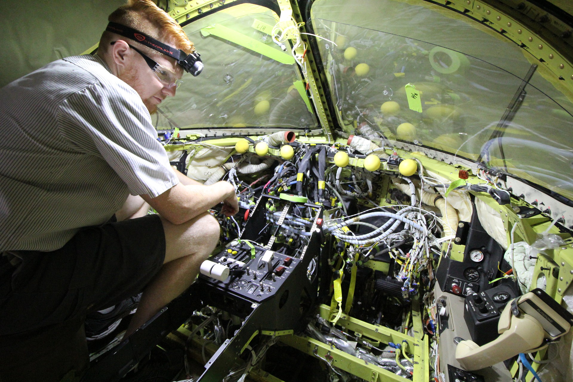 Tyler Lantz, Avionics Installer for Elliott Aviation, works on a Garmin G5000 installation on a Beechjet 400A.