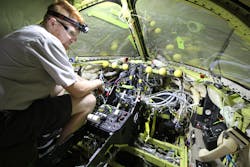 Tyler Lantz, Avionics Installer for Elliott Aviation, works on a Garmin G5000 installation on a Beechjet 400A.