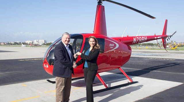 University of North Dakota&rsquo;s Don Dubuque Receives Keys to New R44 Cadet from Robinson&rsquo;s Monica Campos.